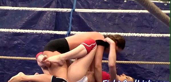  Muscular lesbians wrestling in a boxing ring